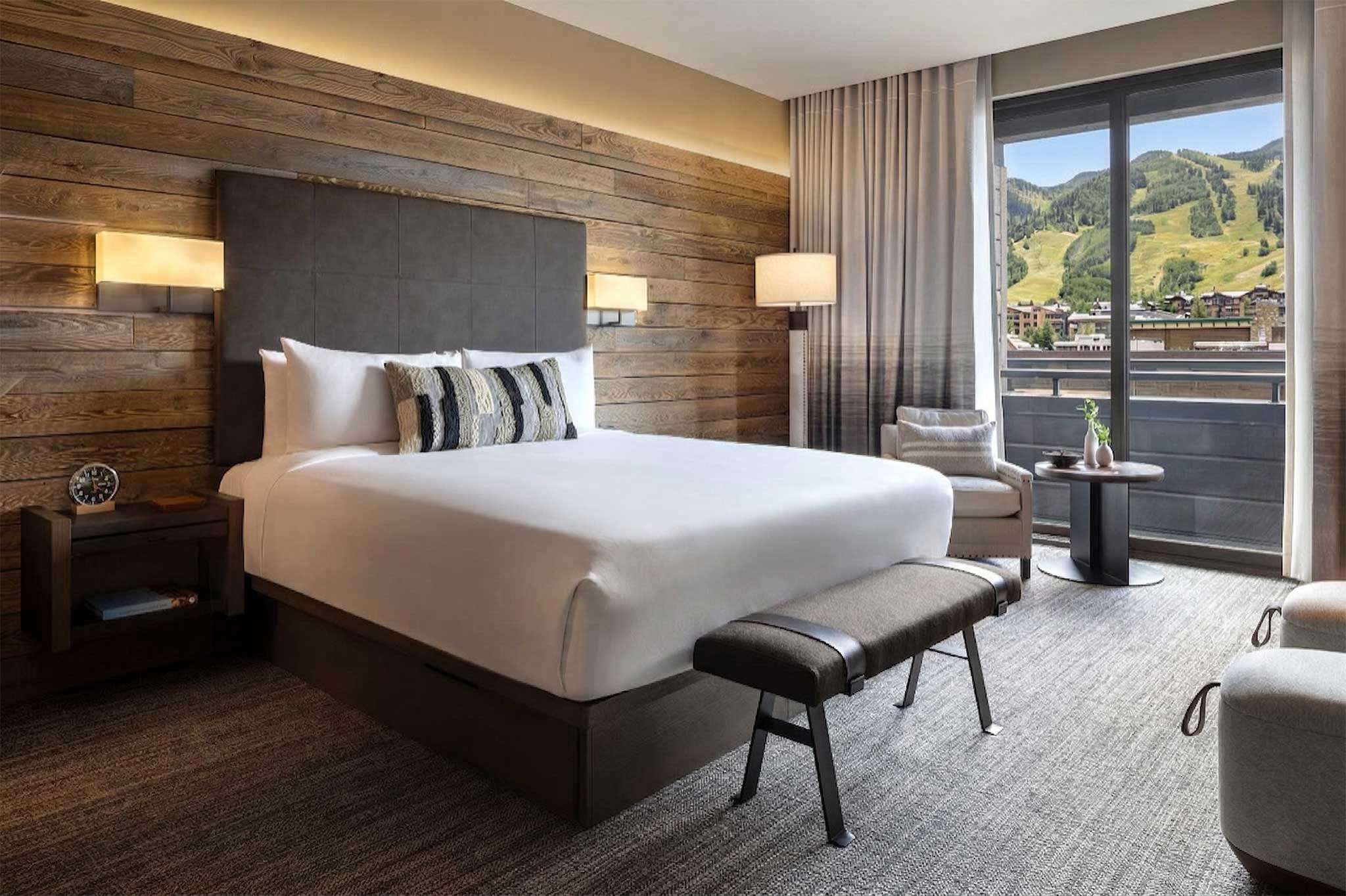 Luxury guest room at Hotel Jackson, Jackson Hole Wyoming — warm western decor with mountain views, Forbes Four Star boutique hotel