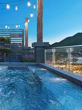 Rooftop hot tub and plunge pool at Hotel Jackson with panoramic evening views of Jackson Hole Wyoming - luxury boutique hotel spa experience