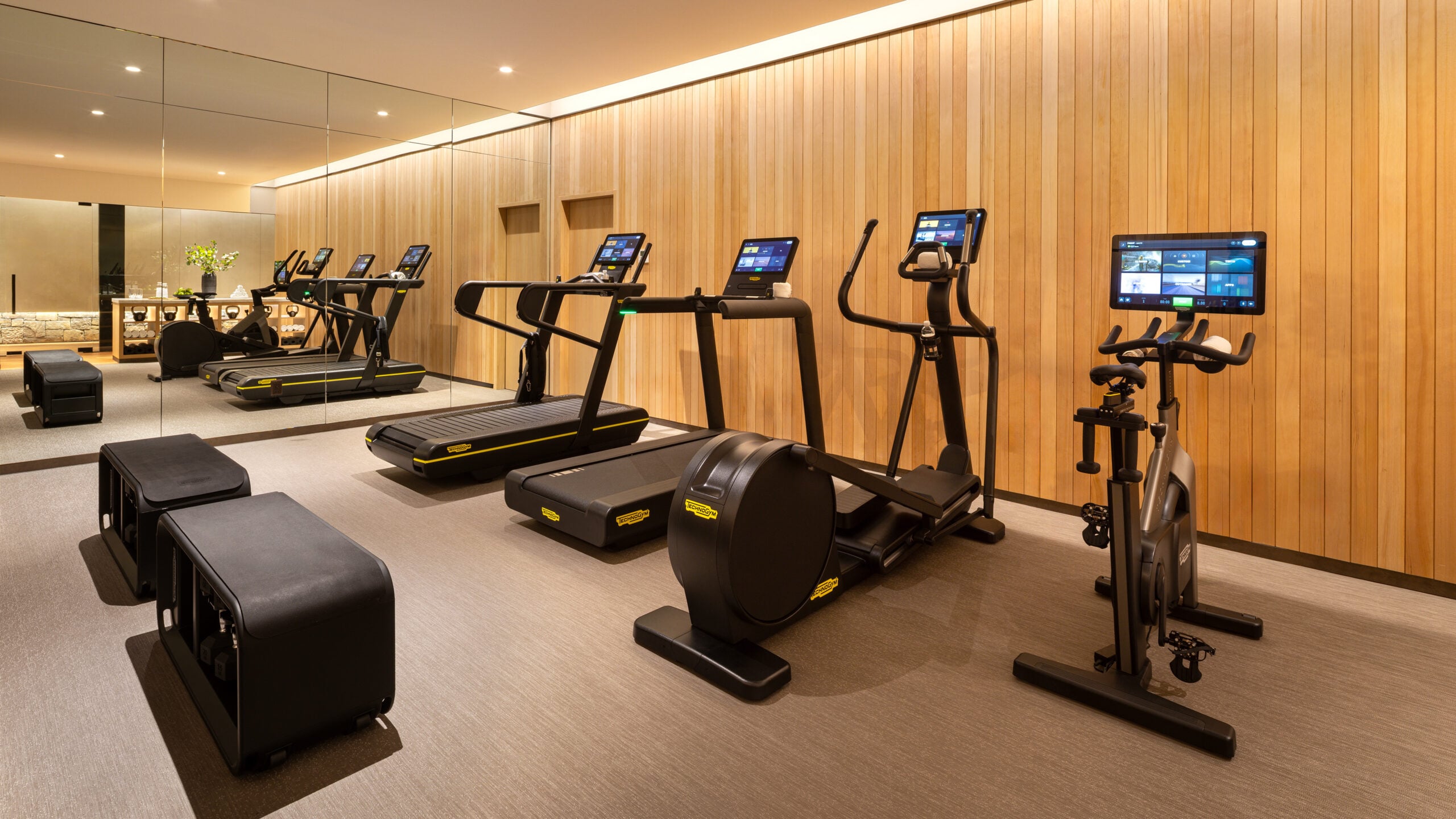 Hotel Jackson fitness centre cardio area, Technogym treadmills, ellipticals and spin bike at luxury boutique hotel, Jackson Hole Wyoming