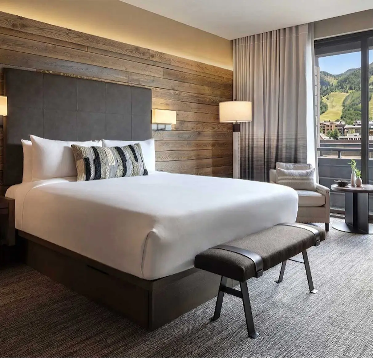 Luxury guest room at Hotel Jackson, Jackson Hole Wyoming — warm western decor with mountain views, Forbes Four Star boutique hotel