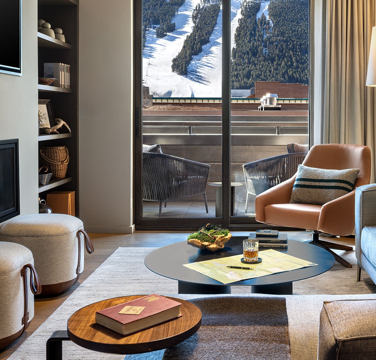 Luxury Hotel Jackson suite living room with private balcony and Snow King Mountain view